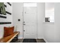 Bright entryway featuring a wooden bench, coat hooks, and a clean, modern design at 2251 N New Jersey St, Indianapolis, IN 46205