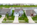 Beautiful aerial view of a home next to a serene pond in a quiet neighborhood at 2396 Creek Bank Dr, Columbus, IN 47201