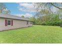 Expansive backyard with lush green grass, providing ample space for recreation and outdoor activities at 2539 S Lyons Ave, Indianapolis, IN 46241