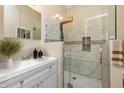 Modern bathroom featuring a glass-enclosed shower, elegant vanity, and stylish fixtures at 3113 Sandpiper N Dr, Indianapolis, IN 46268