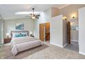 Spacious main bedroom with a ceiling fan and an ensuite bathroom at 3113 Sandpiper N Dr, Indianapolis, IN 46268