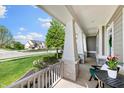Relaxing front porch view with stone accents and charming neighborhood scenery at 3561 Shady Lk Dr, Westfield, IN 46074