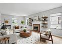 Bright living room boasts a fireplace, neutral tones, and modern decor for a cozy atmosphere at 4730 Rookwood Ave, Indianapolis, IN 46208