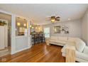 Inviting living room with hardwood floors, an open layout to the kitchen and lots of natural light at 5526 Indianola Ave, Indianapolis, IN 46220