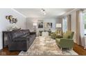 Comfortable living room with plush seating, stylish decor, and abundant natural light at 5851 Grand Ave, Plainfield, IN 46168