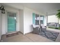 Inviting front porch with seating, charming decor, and a swing at 610 Redwood Dr, Pendleton, IN 46064