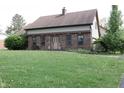 Charming brick home with a well-manicured lawn and inviting front entrance at 9903 E Raymond St, Indianapolis, IN 46239