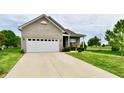 Attractive home with a two-car garage, well-kept lawn, and a welcoming front entrance at 998 Cass Dr, Franklin, IN 46131