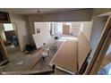 Spacious living room with unfinished drywall, ready for your personal touch and design at 104 N Chester Ave, Indianapolis, IN 46201