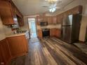 Updated kitchen with stainless steel appliances and sleek flooring at 117 Fountain Lake Dr, Greenfield, IN 46140