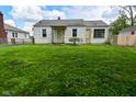 Inviting single-story home featuring a well-maintained lawn and mature landscaping at 1507 N Luett Ave, Indianapolis, IN 46222