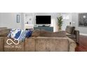 Comfortable living room with a large sofa and modern entertainment setup at 1808 E 11Th St, Indianapolis, IN 46201