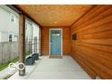 Inviting porch area showcasing wood finishes and a stylish front door at 1808 E 11Th St, Indianapolis, IN 46201