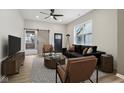 Stylishly furnished living room featuring modern décor, wood floors and sliding barn door at 202 Mckim Ave, Indianapolis, IN 46201