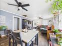 Inviting living space featuring ceiling fans, hardwood floors, and lots of natural light at 2314 Walnut St, Anderson, IN 46016