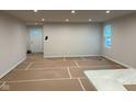 Bright living room featuring recessed lighting, white walls and space for customization at 2334 Black Rock Cir, Lebanon, IN 46052