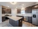 Kitchen featuring an island, stainless appliances, and modern subway tile at 2628 Lamar Dr, Whitestown, IN 46075