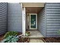 Inviting home entrance with a beautiful flower display, providing a warm welcome at 2823 Somerset Bay, Indianapolis, IN 46240