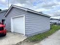 Exterior shot of detached one-car garage, complementing the house's siding at 2924 Main St, Anderson, IN 46016
