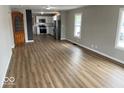 Open concept living space with modern flooring and a view of the kitchen at 2924 Main St, Anderson, IN 46016