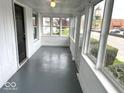 Enclosed front porch with multiple windows offering plenty of natural light at 2924 Main St, Anderson, IN 46016