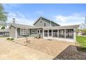 Spacious backyard featuring a brick patio and enclosed sunroom at 315 W High St, Pendleton, IN 46064