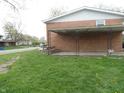 The home features a quaint covered patio for outdoor enjoyment in the backyard at 3426 Ireland Dr, Indianapolis, IN 46235