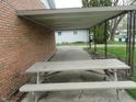 Attached covered patio with a picnic table providing a perfect outdoor seating area at 3426 Ireland Dr, Indianapolis, IN 46235