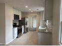 Beautiful kitchen featuring modern white cabinets, stainless steel appliances, and granite counters at 357 N 18Th Ave, Beech Grove, IN 46107