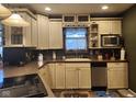 Cozy kitchen with neutral-colored cabinets and modern appliances, great for home-cooked meals at 448 Tamarack Ln, Noblesville, IN 46062