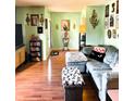 Cozy living room with hardwood floors, a comfortable sofa, and stylish decor throughout the room at 4820 Nowland Ave, Indianapolis, IN 46201