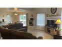 Inviting living room features modern flooring, fireplace, and ample natural light at 562 Harmony Dr, Greenwood, IN 46143