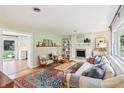 Cozy living room featuring a white brick fireplace and comfortable seating at 5987 E 100 N, Franklin, IN 46131
