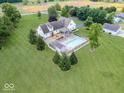 Aerial view of a home with a pool, deck, and fenced yard at 6086 W 850 S, Edinburgh, IN 46124