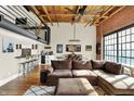 Open-concept living room with loft features modern decor and an inviting atmosphere at 735 Lexington Ave # Apt 27, Indianapolis, IN 46203