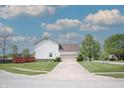 Charming home featuring a well-maintained lawn, two-car garage, and a delightful back deck at 9718 Jupiter Pass, Carmel, IN 46032