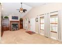 Bright living room with a fireplace, built-in shelving, vaulted ceilings and many windows at 1426 S Anderson St, Elwood, IN 46036