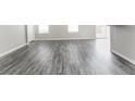 Bright living room with ample natural light, hard surface floors, and neutral paint at 15447 Gallow Ln, Noblesville, IN 46060