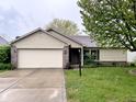 Charming single-story home with a brick and vinyl facade and an attached two-car garage at 2154 Walnut Meadow Ct, Indianapolis, IN 46234