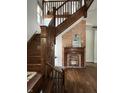 Beautiful wooden staircase next to an exposed brick fireplace at 2161 N Pennsylvania N St, Indianapolis, IN 46202