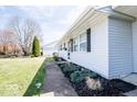 Well-maintained home exterior features a manicured lawn and tidy landscaping at 2763 Streamside Dr, Columbus, IN 47203