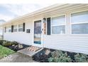 Charming home featuring a welcoming front door and neatly landscaped garden at 2763 Streamside Dr, Columbus, IN 47203