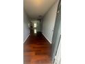 Inviting home entryway with hardwood floors, neutral paint, and access to the living area at 317 Legacy Blvd, Greenwood, IN 46143