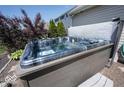 Relaxing hot tub with privacy features in a well-maintained backyard setting at 3311 Stoddard Pl, Indianapolis, IN 46217