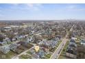 Wide angle aerial view of neighborhood with property marker, city skyline in background at 3331 Graceland Ave, Indianapolis, IN 46208
