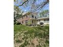 Charming two-story home with a well-manicured lawn, patio, and brick and siding details at 4402 Mountbatten Ct, Indianapolis, IN 46254