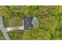 Aerial view of property featuring mature trees, pool, and ample parking at 4475 Berkshire Rd, Indianapolis, IN 46226