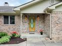 Elegant front entrance with decorative glass door and brick facade at 515 E Hoover Dr, Nineveh, IN 46164