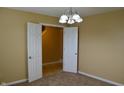 Room featuring neutral walls, carpet and a view of an adjacent room at 5708 Outer Bank Rd, Indianapolis, IN 46239
