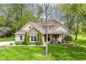 Inviting home exterior featuring stone accents, meticulous landscaping, and lush lawn at 6340 W 800 S, Pendleton, IN 46064
